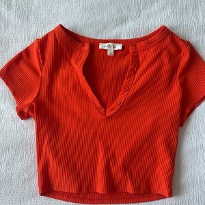 Bright orange cropped top